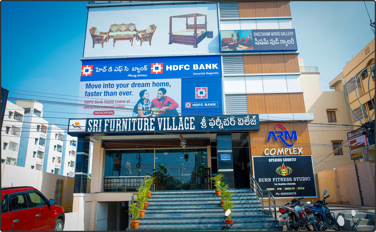 Sri Furniture Village Guntur showroom showcasing handcrafted Sheesham wood furniture