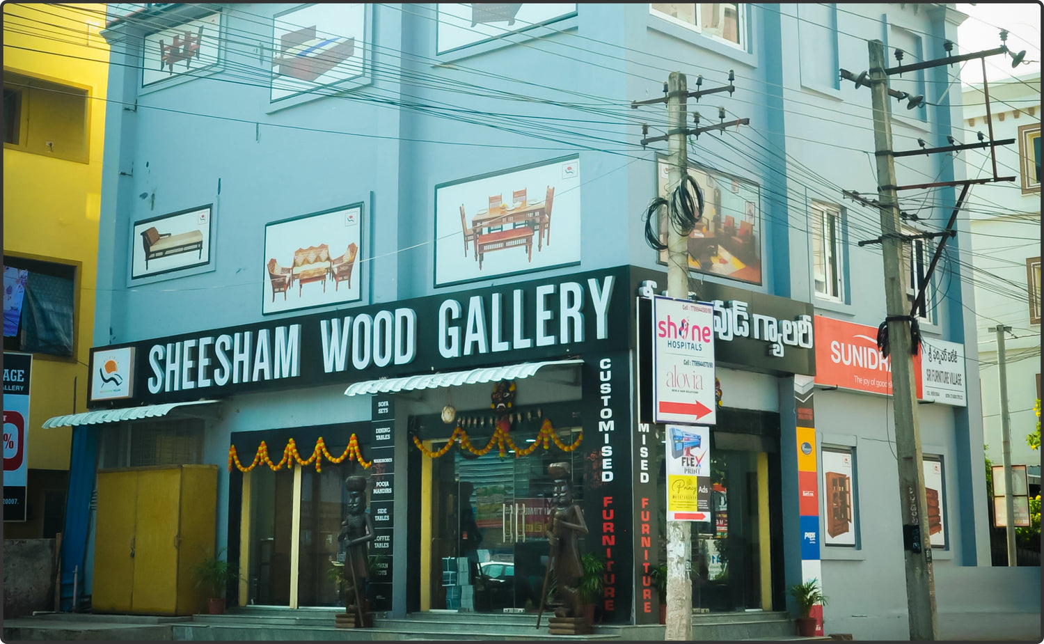 Sri Furniture Village Vijaywada showroom showcasing handcrafted Sheesham wood furniture